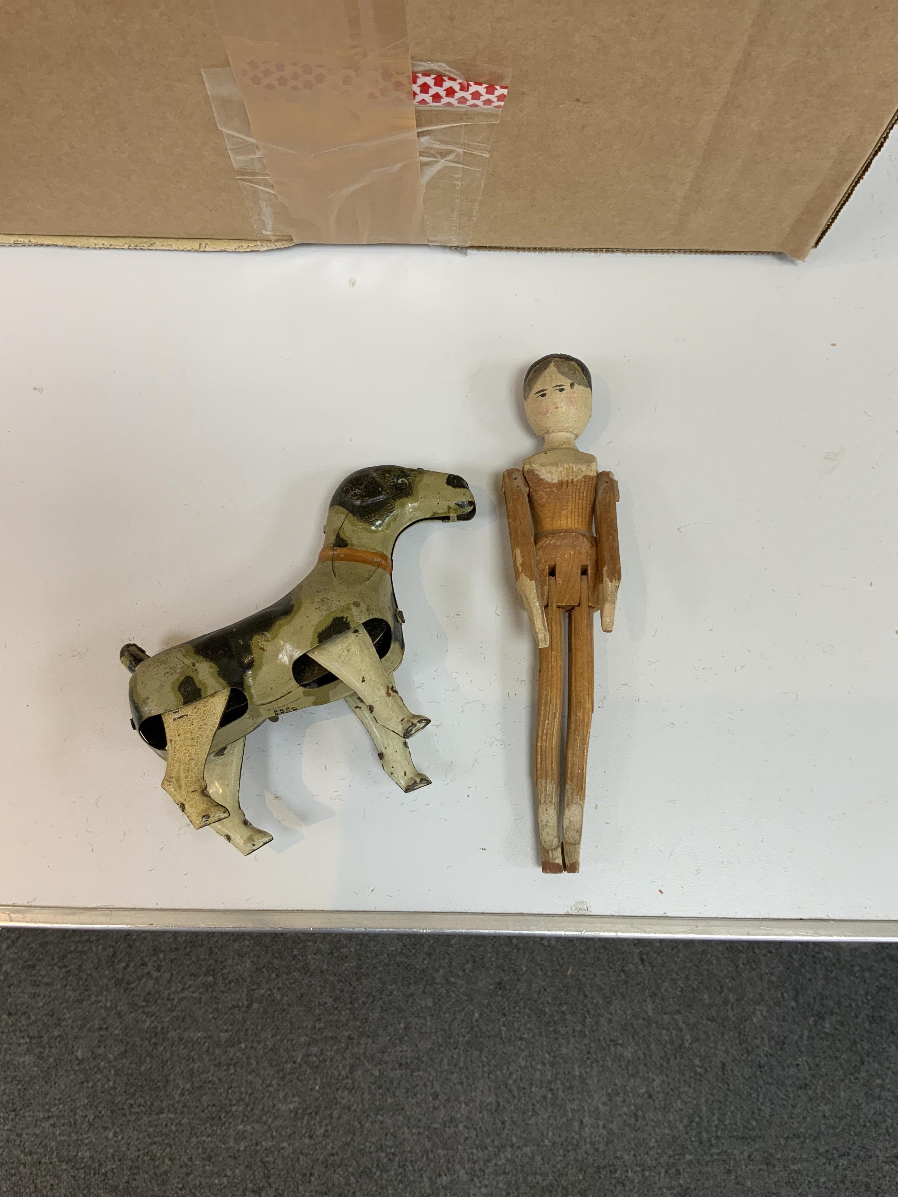 A Schoenhut Humpty Dumpty Circus, early 20th century, including elephant, lion house and other pieces, a playbarn (10) plus a peg doll and a German tinplate clockwork dog